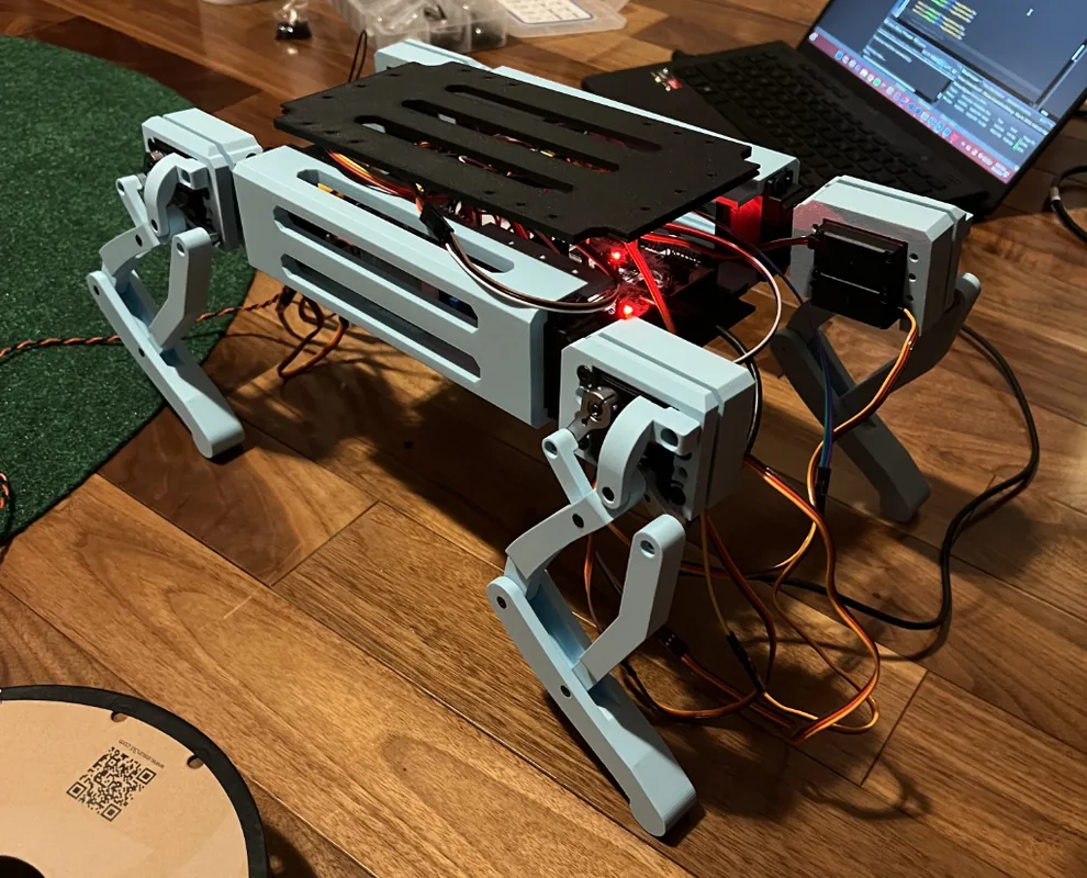 Custom four-legged Robot Dog prototype on a workshop floor